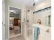 Spacious bathroom featuring glass-enclosed shower, tile accents, and a view to the bedroom at 600 Old Johnson Rd, Lawrenceville, GA 30045