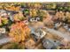 A two story home from above showing off the large deck, fenced backyard, and trees changing color at 600 Old Johnson Rd, Lawrenceville, GA 30045