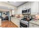 Modern kitchen with stainless steel appliances and granite countertops at 600 Old Johnson Rd, Lawrenceville, GA 30045