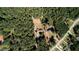 High-altitude aerial perspective showcasing a house situated within a wooded area near a road at 11790 Brown Bridge Rd, Covington, GA 30016