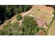 Aerial view of a ranch-style home nestled among trees with a large yard at 11790 Brown Bridge Rd, Covington, GA 30016