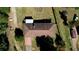 Top-down aerial view of a house with a brown roof and carport at 11790 Brown Bridge Rd, Covington, GA 30016