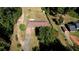 Elevated view of a single-story home with a long driveway, surrounded by trees at 11790 Brown Bridge Rd, Covington, GA 30016