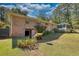 Backyard view of house with brick exterior and a sunroom at 11790 Brown Bridge Rd, Covington, GA 30016