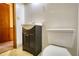 Simple bathroom with white sink, dark vanity, and toilet at 11790 Brown Bridge Rd, Covington, GA 30016