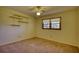 Empty bedroom with carpet, built-in shelves, and windows at 11790 Brown Bridge Rd, Covington, GA 30016