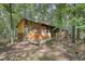 Rustic cabin nestled among trees at 11790 Brown Bridge Rd, Covington, GA 30016