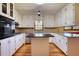 Bright kitchen with white cabinets, granite counters, and a center island at 11790 Brown Bridge Rd, Covington, GA 30016