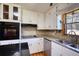 Kitchen with stainless steel appliances, white cabinets, and granite counters at 11790 Brown Bridge Rd, Covington, GA 30016