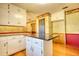 Kitchen with white cabinets, granite counters, an island, and wood floors at 11790 Brown Bridge Rd, Covington, GA 30016