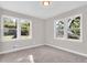 Bright bedroom with neutral walls, new carpet, and large windows at 2139 Rosebud Rd, Grayson, GA 30017