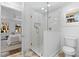 Modern bathroom with a glass shower, white fixtures, and tiled floor at 2010 Drew Valley Ne Rd, Atlanta, GA 30319