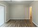 Bright bedroom with hardwood floors and sliding glass doors at 2348 Clifton Springs Mnr, Decatur, GA 30034