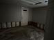 Unfinished basement room with exposed framing, concrete floor, and a door at 125 Belmont Farms Dr, Ellenwood, GA 30294