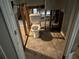 Bathroom under renovation, showing a toilet and exposed framing at 125 Belmont Farms Dr, Ellenwood, GA 30294