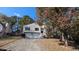 Two-story house with a two-car garage and mature trees in the front yard at 3813 Nowlin Nw Rd, Kennesaw, GA 30144