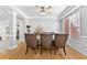 Bright dining room with hardwood floors, a large table and chairs, and access to the kitchen at 1721 Telfair Chase Way, Lawrenceville, GA 30043