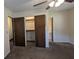 Spacious bedroom with multiple closets and access to a bathroom at 5570 Deerfield Nw Pl, Kennesaw, GA 30144