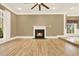 Bright living room with hardwood floors, fireplace, and abundant natural light at 271 Brooks Rackley Rd, Dallas, GA 30157