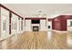 Living room with hardwood floors, fireplace, and built-in shelving at 271 Brooks Rackley Rd, Dallas, GA 30157