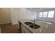 Kitchen island with double sink and granite countertop at 2777 Lou Lou Ln, Buford, GA 30519