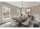 Elegant dining room with chandelier and hardwood floors at 3014 Heatherton Park Way, Roswell, GA 30075