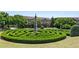 Landscaped community garden with a unique hedge maze at 3014 Heatherton Park Way, Roswell, GA 30075