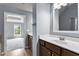 Main bathroom with double vanity and view of bedroom at 3014 Heatherton Park Way, Roswell, GA 30075