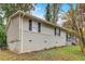 Side view of a newly renovated home with gray brick and siding at 1101 White Oak Sw Ave, Atlanta, GA 30310