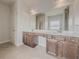 Bathroom with double vanity and large mirror at 5315 Hopewell Manor Dr, Cumming, GA 30028