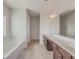 Spacious bathroom with double vanity, soaking tub, and separate shower at 5315 Hopewell Manor Dr, Cumming, GA 30028