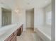 Large bathroom with double vanity and garden tub at 5315 Hopewell Manor Dr, Cumming, GA 30028