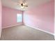 Pink bedroom with ceiling fan and window at 5315 Hopewell Manor Dr, Cumming, GA 30028