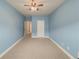 Bedroom with ceiling fan and access to hallway at 5315 Hopewell Manor Dr, Cumming, GA 30028