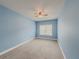 Light blue bedroom with ceiling fan and window at 5315 Hopewell Manor Dr, Cumming, GA 30028