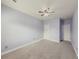 Spacious bedroom with ceiling fan and neutral carpeting at 5315 Hopewell Manor Dr, Cumming, GA 30028
