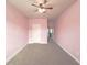 Spacious bedroom with ceiling fan and neutral wall paint at 5315 Hopewell Manor Dr, Cumming, GA 30028
