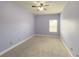 Bright bedroom featuring a window and ceiling fan at 5315 Hopewell Manor Dr, Cumming, GA 30028