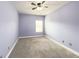 Spacious bedroom with neutral walls and carpet flooring at 5315 Hopewell Manor Dr, Cumming, GA 30028