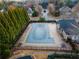 Community swimming pool with safety cover and surrounding landscaping at 5315 Hopewell Manor Dr, Cumming, GA 30028