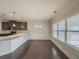 Bright dining room with hardwood floors and chandelier, adjacent to kitchen at 5315 Hopewell Manor Dr, Cumming, GA 30028