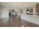 Open concept dining room with hardwood floors, adjacent to kitchen at 5315 Hopewell Manor Dr, Cumming, GA 30028