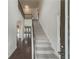 Two-story entryway with hardwood floors and an elegant staircase at 5315 Hopewell Manor Dr, Cumming, GA 30028
