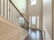 Two-story entryway with hardwood floors and an elegant staircase at 5315 Hopewell Manor Dr, Cumming, GA 30028