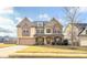 Two-story house with stone accents and a landscaped yard at 5315 Hopewell Manor Dr, Cumming, GA 30028