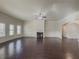 Large great room with hardwood floors, fireplace and multiple windows at 5315 Hopewell Manor Dr, Cumming, GA 30028