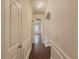 Bright hallway with hardwood floors and neutral paint at 5315 Hopewell Manor Dr, Cumming, GA 30028