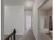 Upstairs hallway with bathroom access at 5315 Hopewell Manor Dr, Cumming, GA 30028