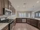 Modern kitchen with granite countertops and stainless steel appliances at 5315 Hopewell Manor Dr, Cumming, GA 30028