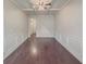 Spacious living room with hardwood floors, coffered ceiling, and a ceiling fan at 5315 Hopewell Manor Dr, Cumming, GA 30028